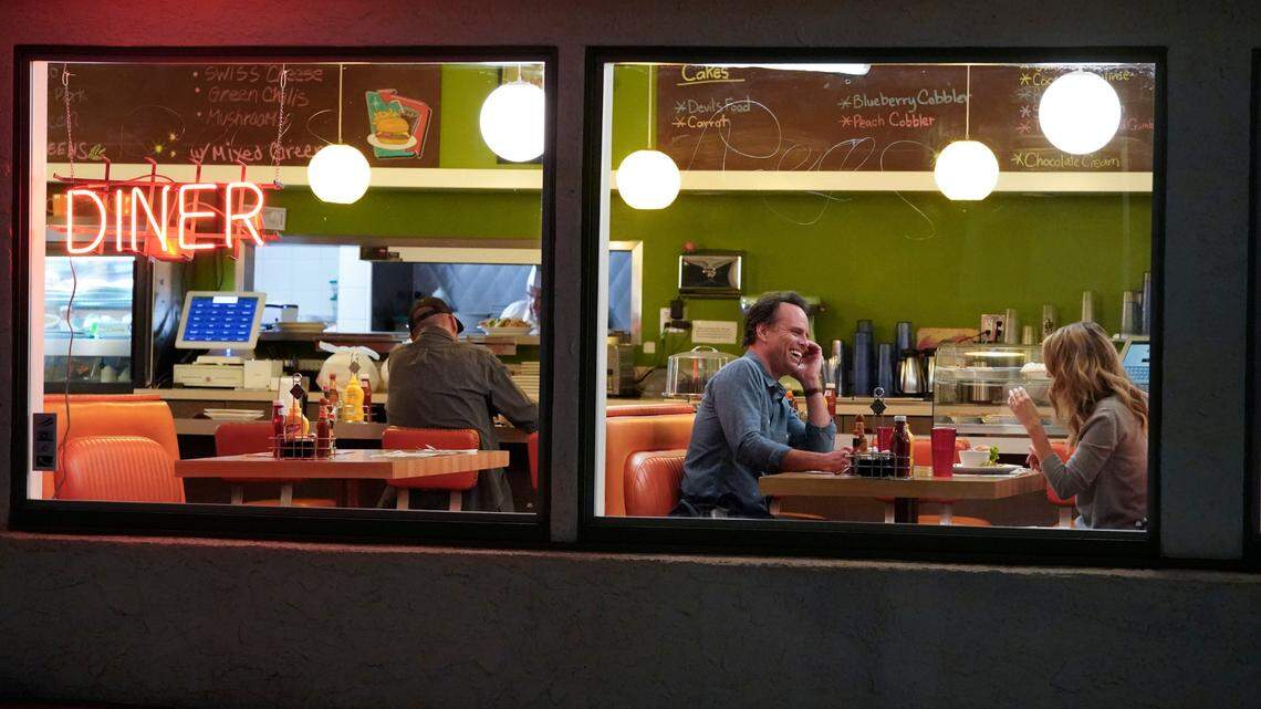 Walton Goggins, left, as Wade, and Natalie Zea as Shannon in the March 4, 2021, episode of “The Unicorn” on CBS.