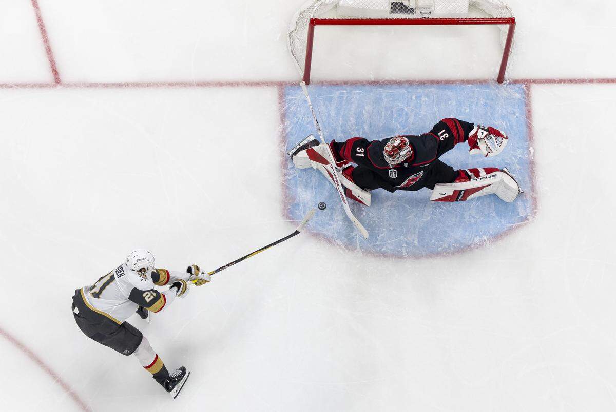 Las Vegas center Brett Howden (21) scores on Carolina Hurricanes goalie Frederik Andersen (31) to take a 4-3 lead in the third period of Game 1 in the Stanley Cup Finals, on Tuesday, June 2, 2026 at Lenovo Center in Raleigh, N.C.