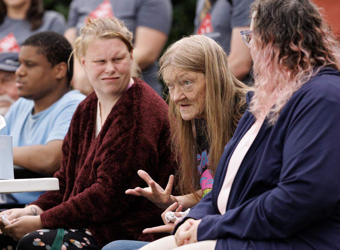Joyce Lester, center, a displaced resident of Camelot Village, speaks during a press conference on Wednesday, Aug. 20, 2025, in Durham, N.C., about her experience after floodwaters from Tropical Depression Chantal severely damaged her apartment. Some displaced residents have been living in a Comfort Inn, accommodations paid for with emergency funds from Chapel Hill and Orange County. That ends next week, leaving at least six people at risk of homelessness.