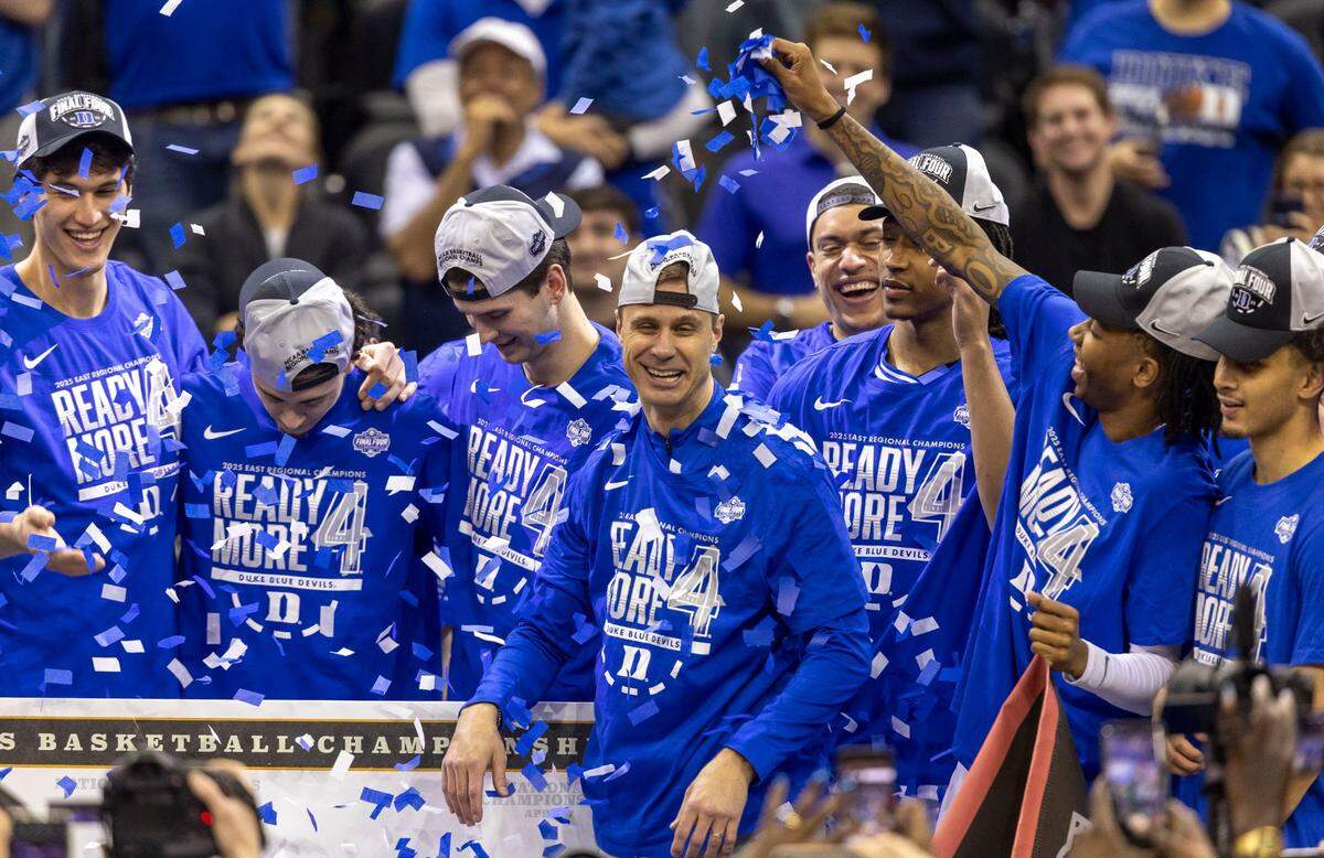 Duke coach Jon Scheyer celebrates with his team after their 85-65 victory over Alabama on Saturday, March 29, 2025 during the NCAA East Regional final at Prudential Center in Newark, N.J.