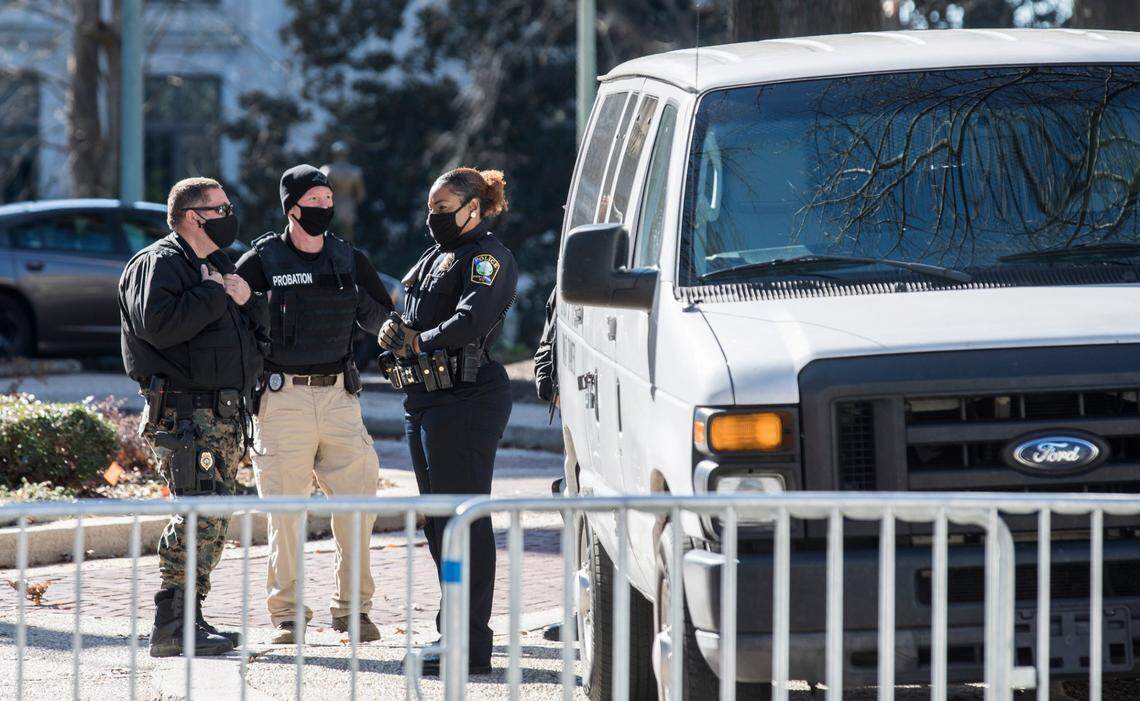 Law enforcement officers occupy the North Carolina State Capitol grounds on Inauguration Day, Wednesday, Jan. 20, 2021.