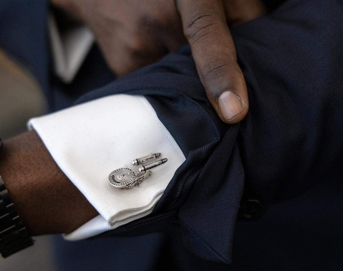 New Wake County Superintendent Robert Taylor shows off his Star Trek USS Enterprise cuff links during a tour of Rolesville Elementary School on his first day on the job, Monday, Oct. 2, 2023.