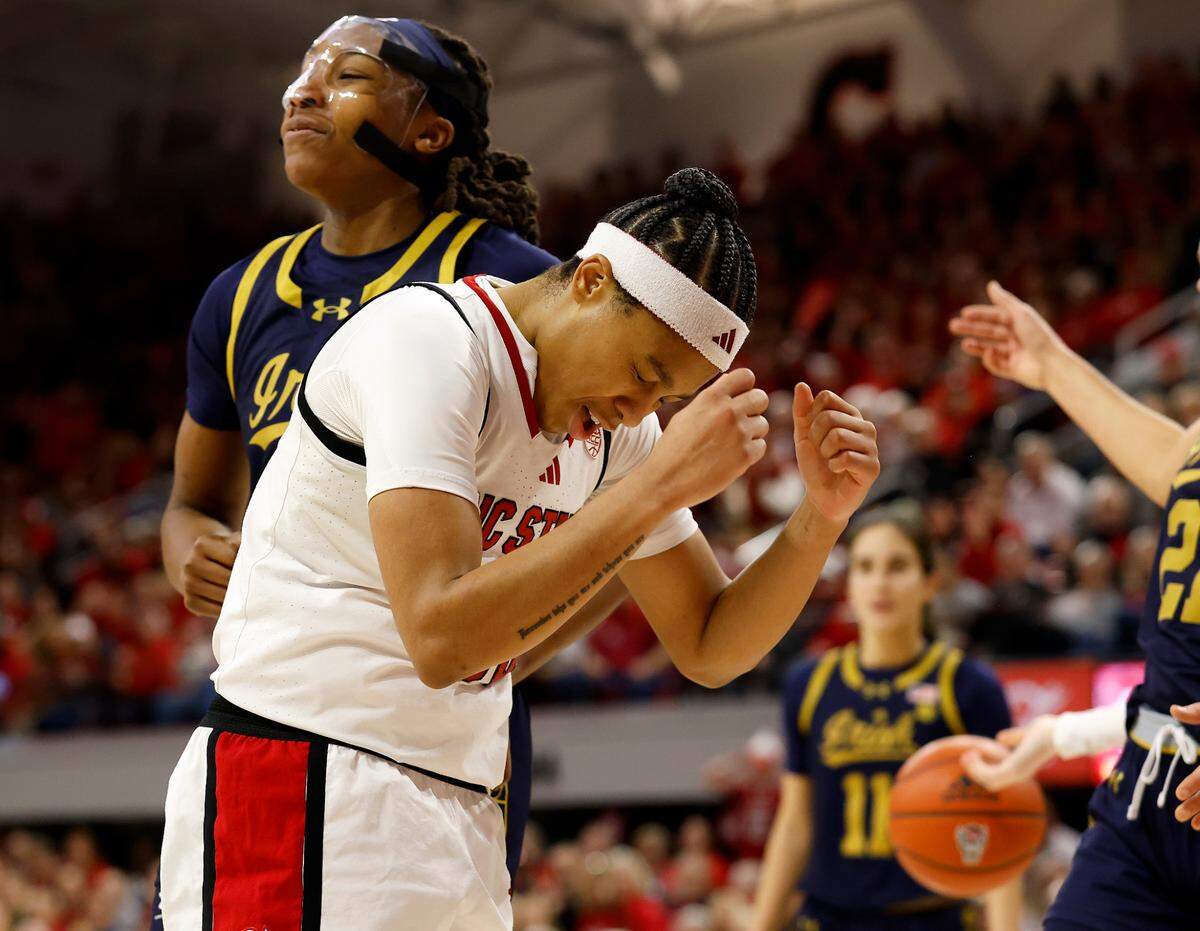 N.C. State’s Zoe Brooks reacts after drawing a foul during the second half of the Wolfpack’s 104-95 double overtime win over Notre Dame on Sunday, Feb. 23, 2025, at Reynolds Coliseum in Raleigh, N.C.