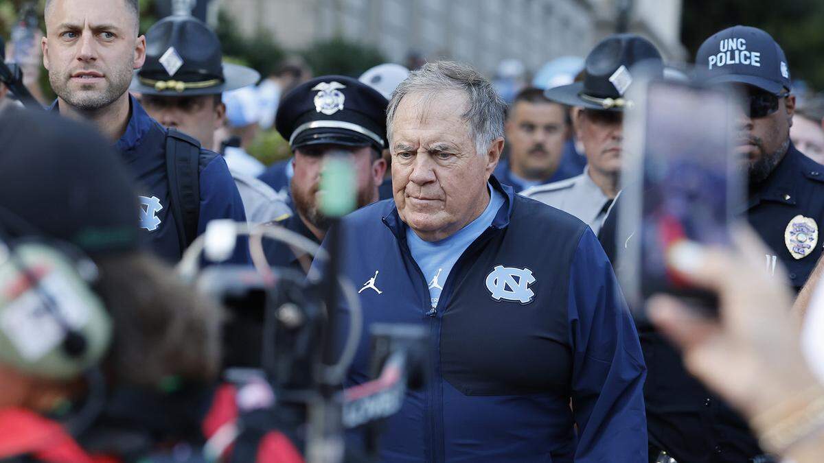 North Carolina head coach Bill Belichick walks towards Kenan Stadium during the Old Well Walk before UNC’s game against TCU in Chapel Hill, N.C., Monday, Sept. 1, 2025.