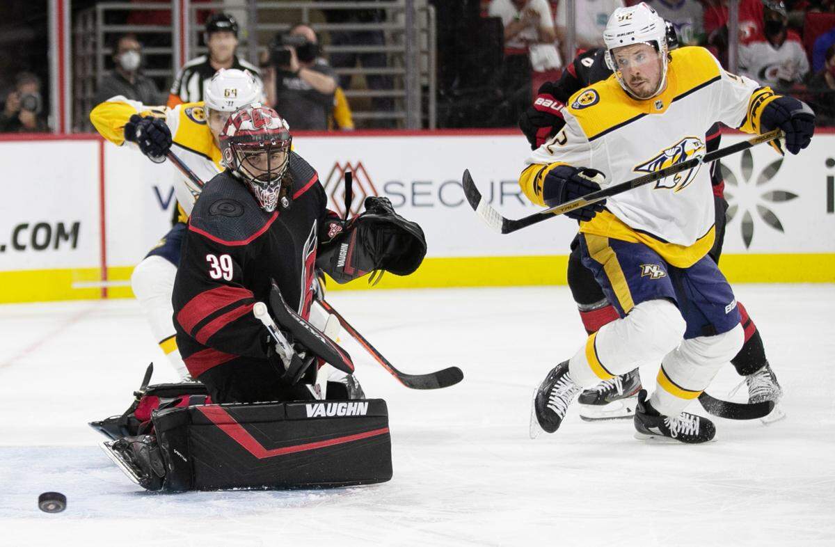 Carolina Hurricanes’ goalie Alex Nedeljkovic (39) deflects a shot attempt by Nashville’s Ryan Johansen (92) in the first period during game two of their first round Stanley Cup playoff series on Wednesday, May 19, 2021 at PNC Arena in Raleigh, N.C.