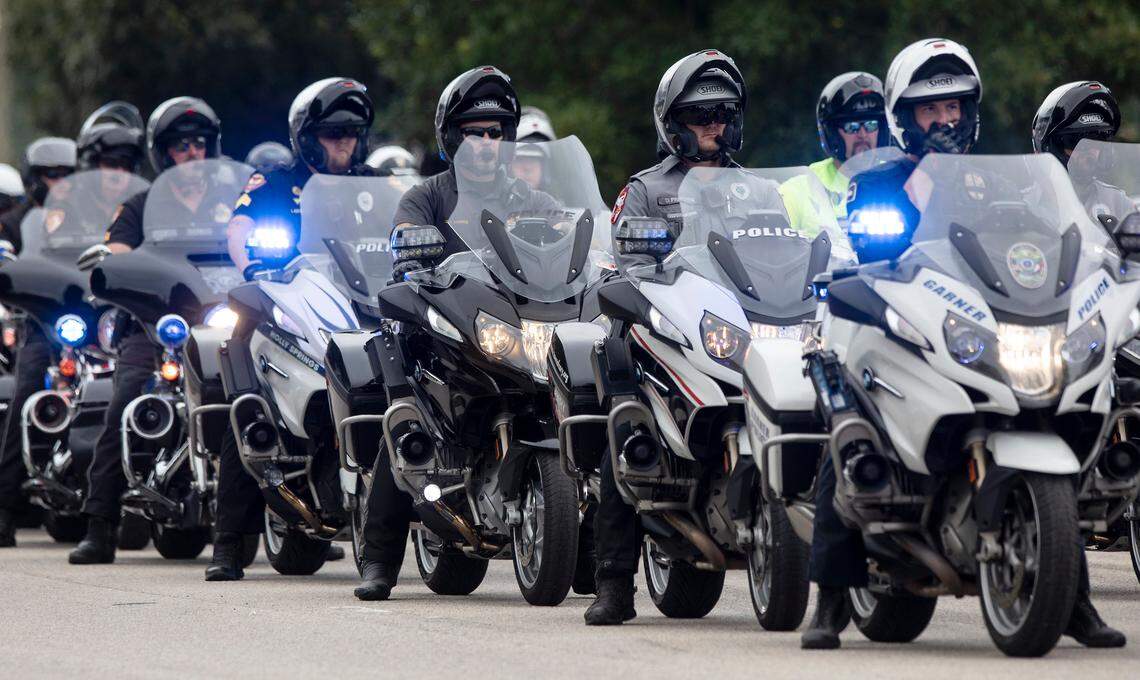 Law enforcement officers prepare to ride ahead of the N.C. State Highway Patrolís Caisson Unit as it carries the casket of slain Wake County Sheriffís Deputy Ned Byrd down Glenwood Avenue on Friday, Aug. 19, 2022, in Raleigh, N.C. Byrd was found dead with multiple gunshot wounds early Friday morning, Aug. 12 in southeastern Wake County.