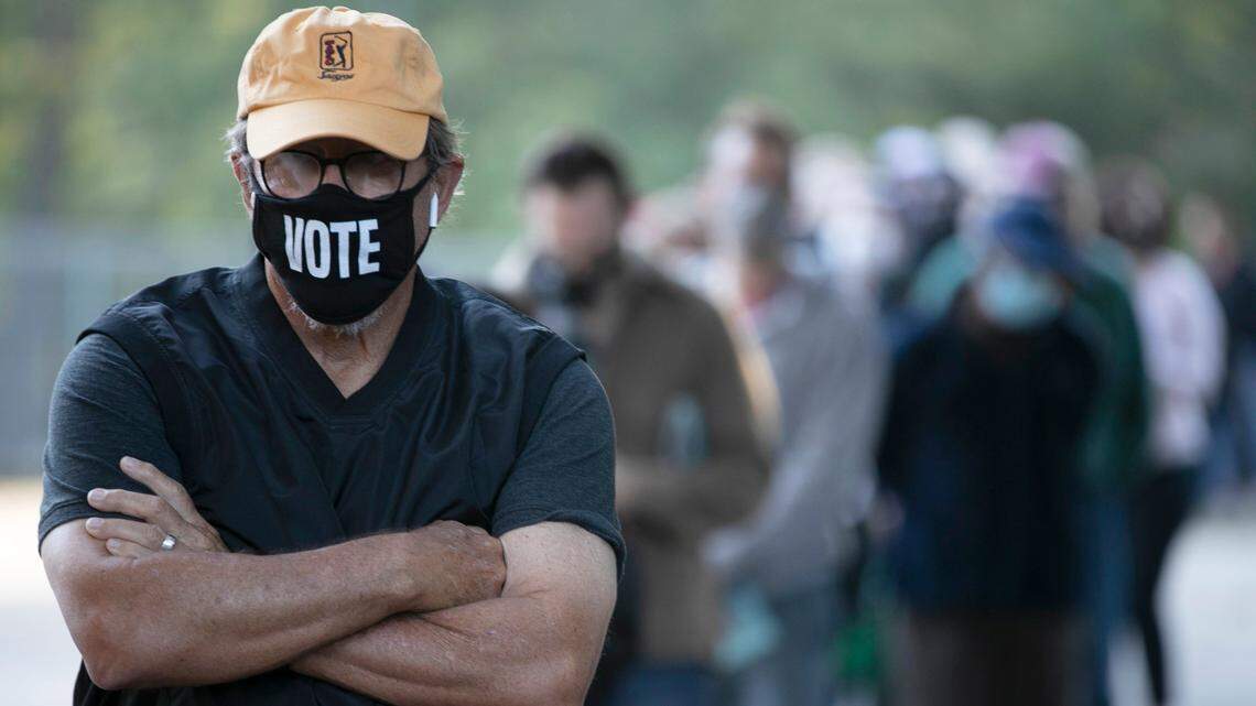 Walter Teague waits in line to vote at the Roberts Park early voting site on Thursday morning, October 15, 2020 in Raleigh, N.C. The Raleigh City Council wants a state law changed to move its 2021 city council election to 2022. Future municipal elections would be in even years.