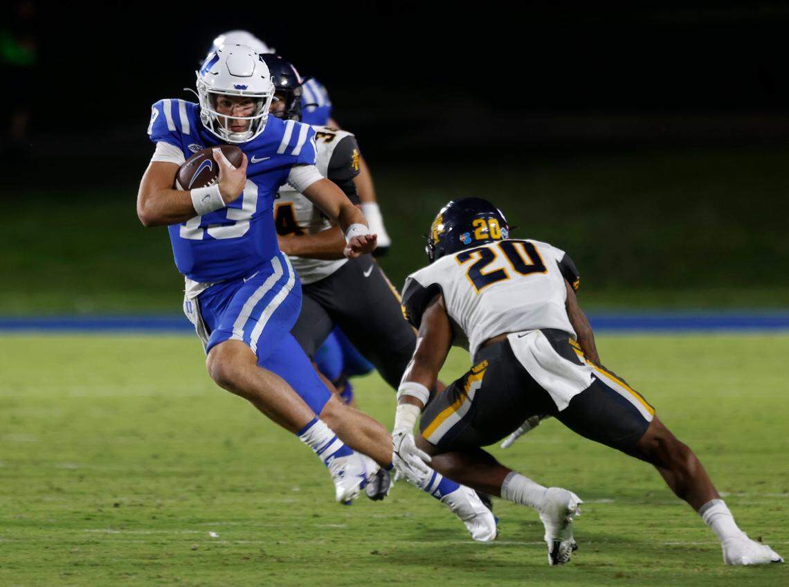 Duke Blue Devils quarterback Riley Leonard runs the ball past North Carolina A&T Aggies defensive back Avarion Cole during the second half of Dukes game against North Carolina A&T at Wallace Wade Stadium in Durham, N.C. on Saturday, Sept. 17, 2022.
