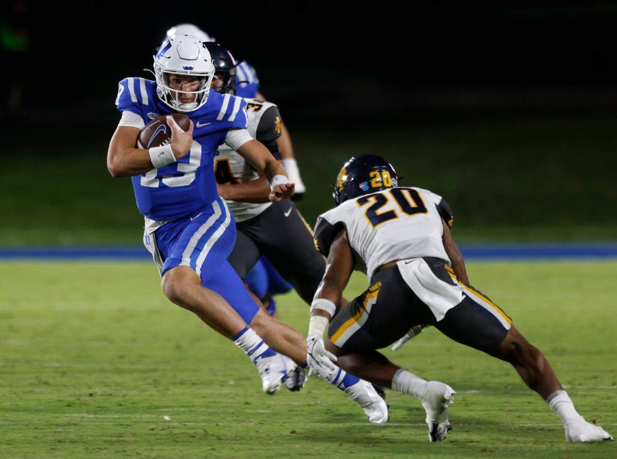 Duke Blue Devils quarterback Riley Leonard runs the ball past North Carolina A&T Aggies defensive back Avarion Cole during the second half of Dukes game against North Carolina A&T at Wallace Wade Stadium in Durham, N.C. on Saturday, Sept. 17, 2022.