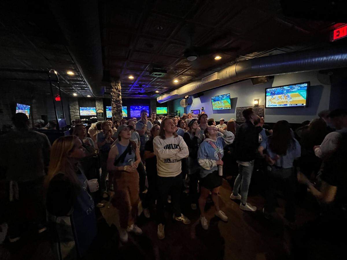 UNC fans at Might As Well in Chapel Hill watch the national championship game in silence as Kansas erases a 15-point Tar Heels lead.