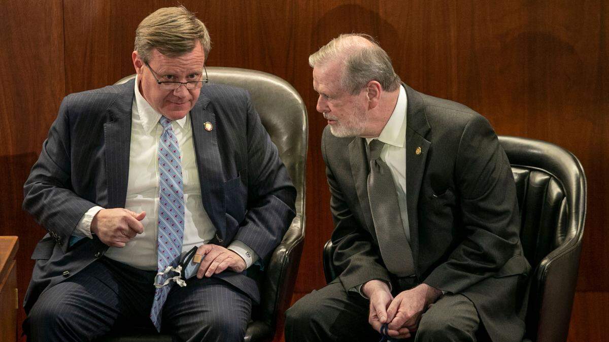 North Carolina House Speaker Tim Moore talks with N.C. Sen. Leader Phil Berger as they await the arrival of Gov. Roy Cooper for the State of the State address on Monday, April 26, 2021 in Raleigh, N.C.