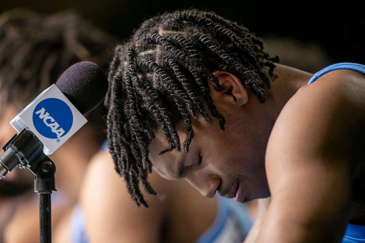 North Carolina’s Caleb Love (2) hangs his head after answering a question about the Tar Heels’ loss to Kansas in the NCAA Championship game on Monday, April 4, 2022 at Caesars Superdome in New Orleans, La.