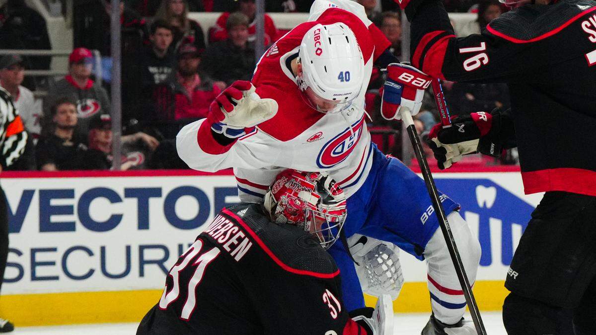 Montreal Canadiens right wing Joel Armia (40) collides with Carolina Hurricanes goaltender Frederik Andersen (31) during the second period at PNC Arena.