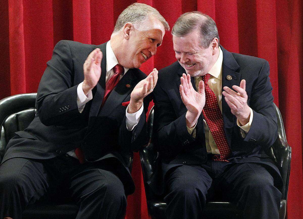 House leader Thom Tillis, left, and Senate leader Phil Berger applaud during Gov. Pat McCrory’s State of the State address in February 2013.