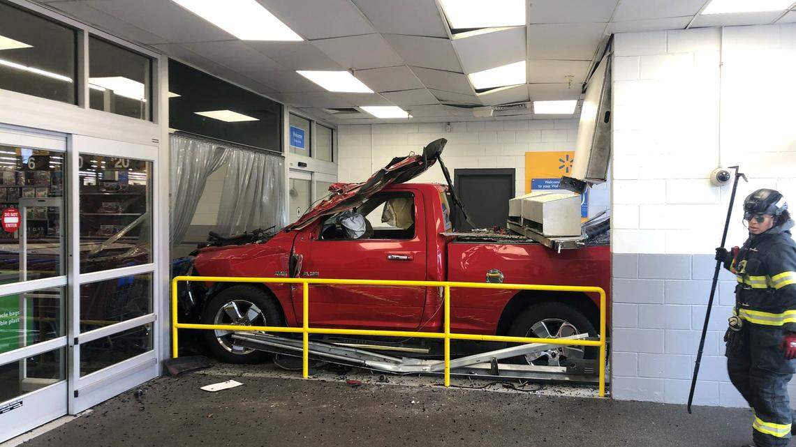 Three people were hurt in the crash, which left a pickup truck damaged, a photo shows.