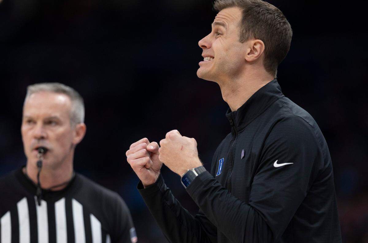 Duke coach Jon Scheyer encourages his players on defense in the second half against N.C. State during the quarterfinals of the ACC Men’s Basketball Tournament at Capitol One Arena on Wednesday, March 13, 2024 in Washington, D.C.