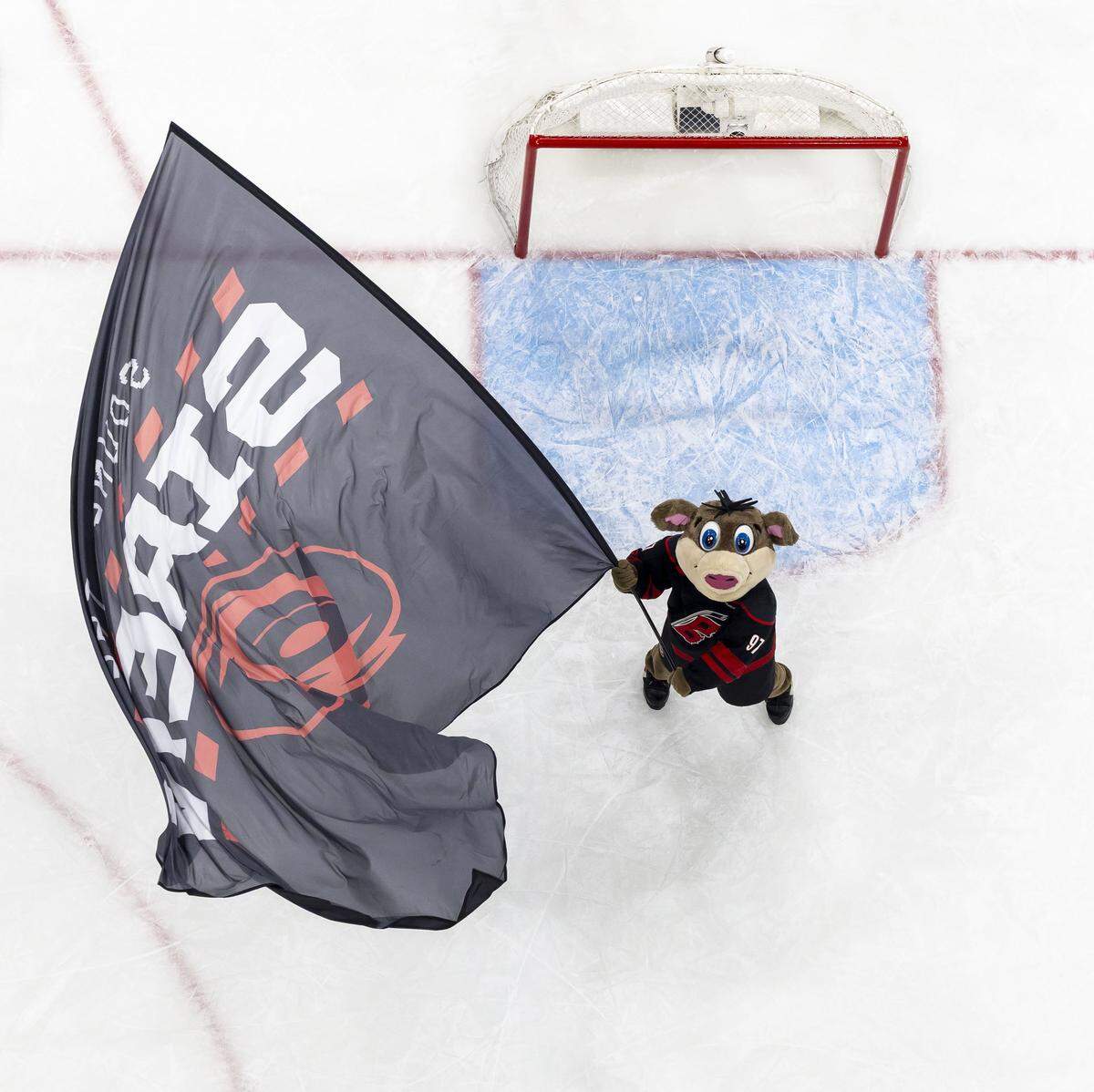 Stormy, the Carolina Hurricanes’ mascot, waves the team flag following the 3-0 victory in Game 1 over Philadelphia on Saturday, May 2, 2026, during the second round of the Stanley Cup Playoffs at Lenovo Center in Raleigh, N.C.