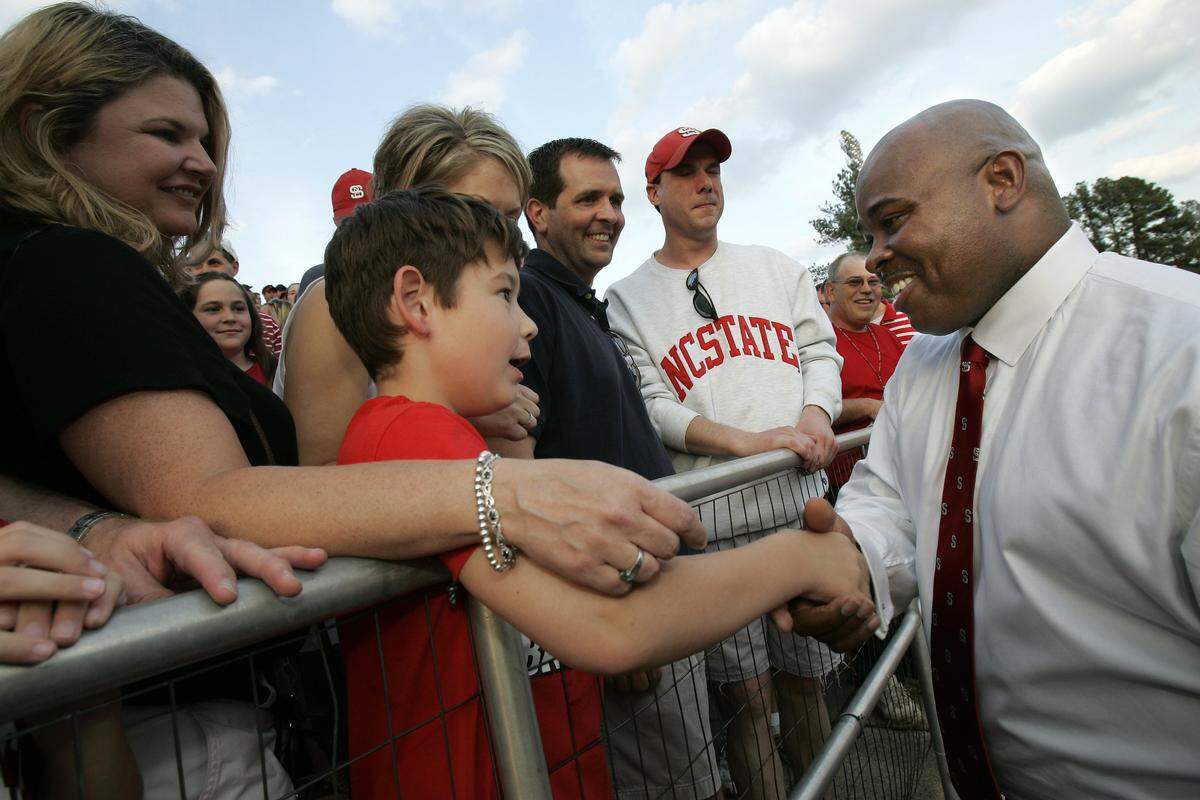 Sidney Lowe, wows the fans at N.C. State's Paul Derr Track on Saturday, May 6, 2006 after being introduced as the Wolfpack’s new basketball coach.