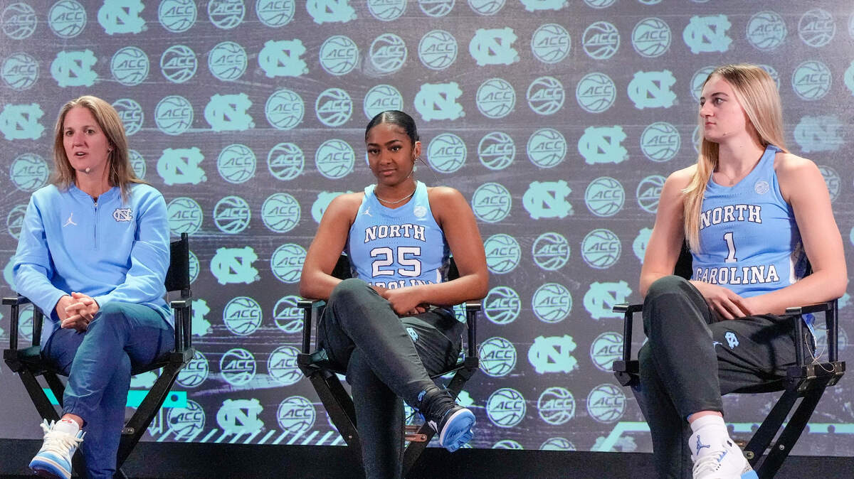 North Carolina coach Courtney Banghart and seniors Deja Kelly and Alyssa Usby chat during the ACC Womens Tipoff at Hilton Charlotte Uptown on Oct. 24. On Tuesday at the Jumpman Invitational, Kelly and Ustby led the Heels to a win over Oklahoma.