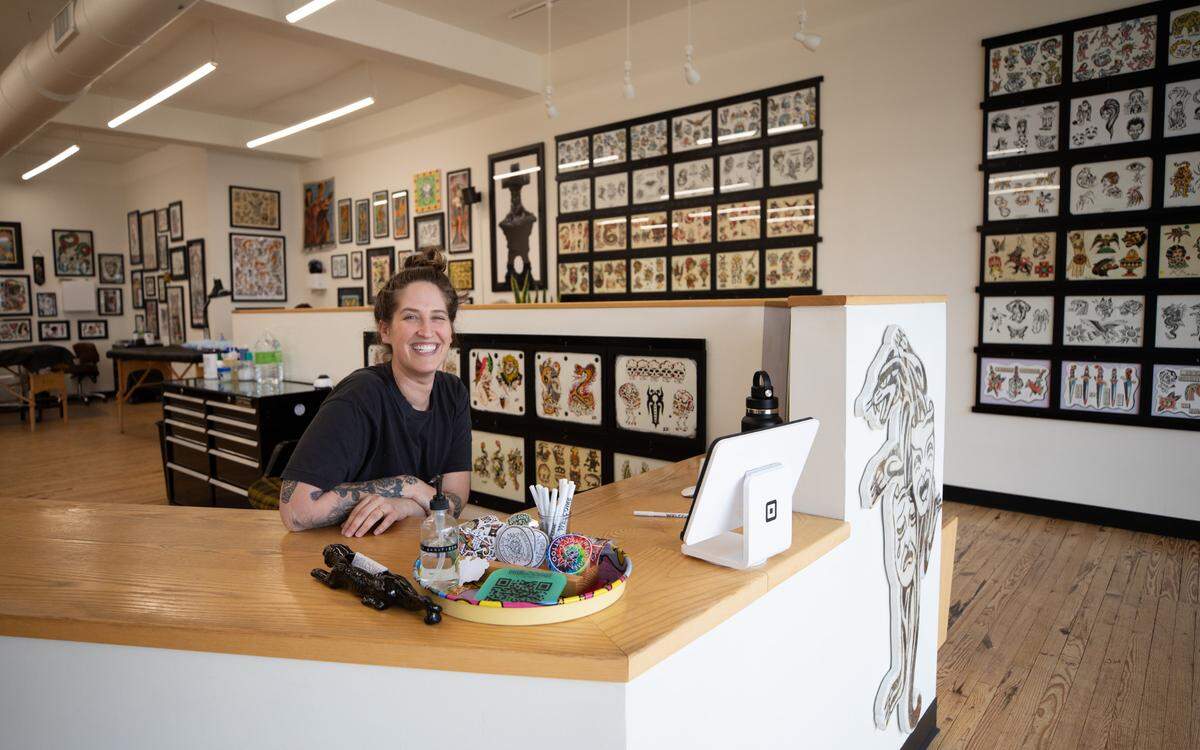 Morgan Grimm, co-owner of Welcome Tattoo in Durham, N.C., poses for a portrait on Wednesday, June 21, 2023. Grimm opened the shop four years ago with co-owner Kohen Meyers.
