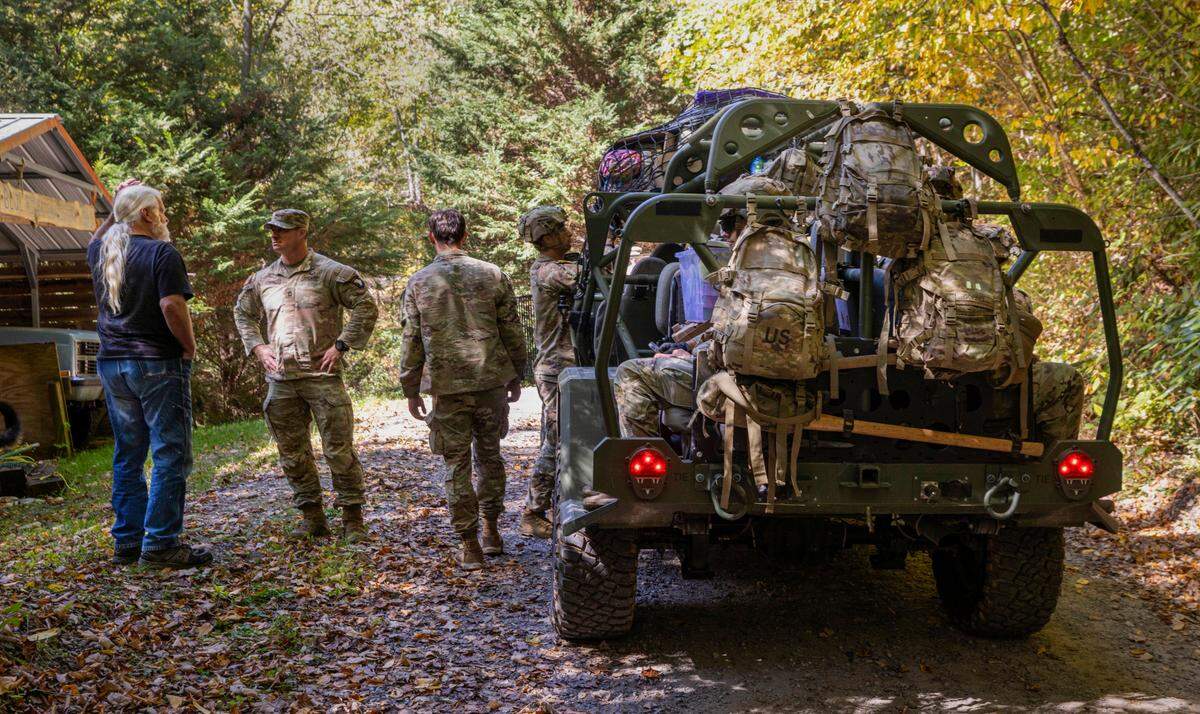 Soldiers with the 101st Airborne Division Air Assault, 2nd Brigade Combat Team, from Fort Campbell, Kentucky, use Infantry Squad Vehicles to deliver water, food, toiletries, and other aid to residents in the Soco Gap community in Maggie Valley on Tuesday, October. 8, 2024. The team has been using the Maggie Valley Pavilion and Town Hall as a distribution base for relief efforts in the town following Tropical Storm Helene.