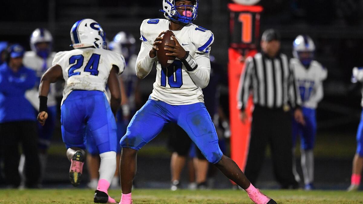 Clayton quarterback Johnathan Montague looks to pass downfield against Willow Spring during the first half. The Clayton Comets and the Willow Spring Storm met in a conference football game in Fuquay-Varina, N.C. on October 20, 2023.
