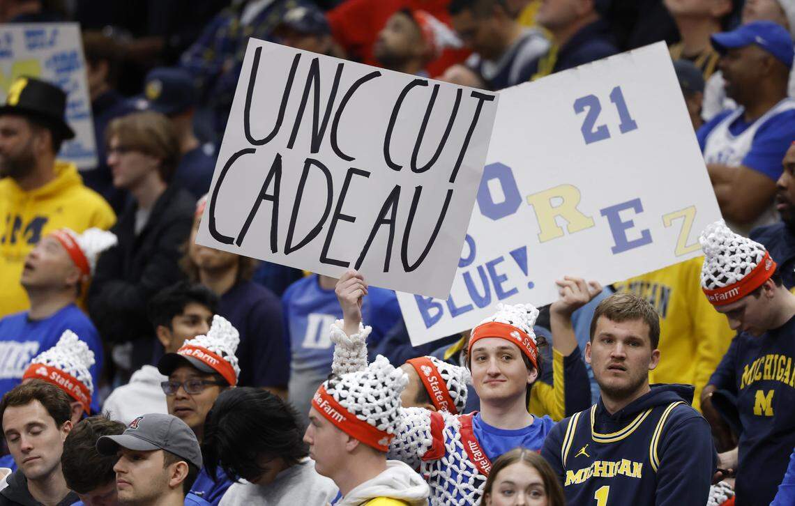 Fans display signs during Michigan basketball’s open practice during ESPN’s College GameDay at Capital One Arena in Washington, D.C., Saturday, Feb. 21, 2026.