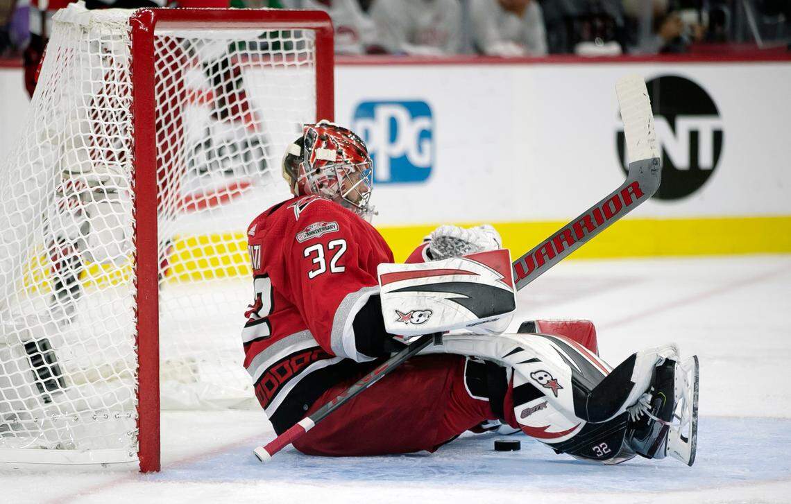 The puck ends up beneath Carolina Hurricanes goalie Antii Raanta (32) after a goal by the Florida Panthers Aleksander Barkov (16) to tie the score 1-1 in the second period during Game 2 of the Eastern Conference Finals on Saturday, May 20, 2023 at PNC Arena in Raleigh, N.C.