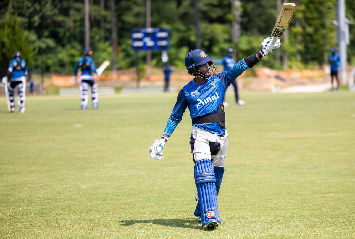 Players from the Sri Lankan Lions cricket team practice at Church Street Park in Morrisville.