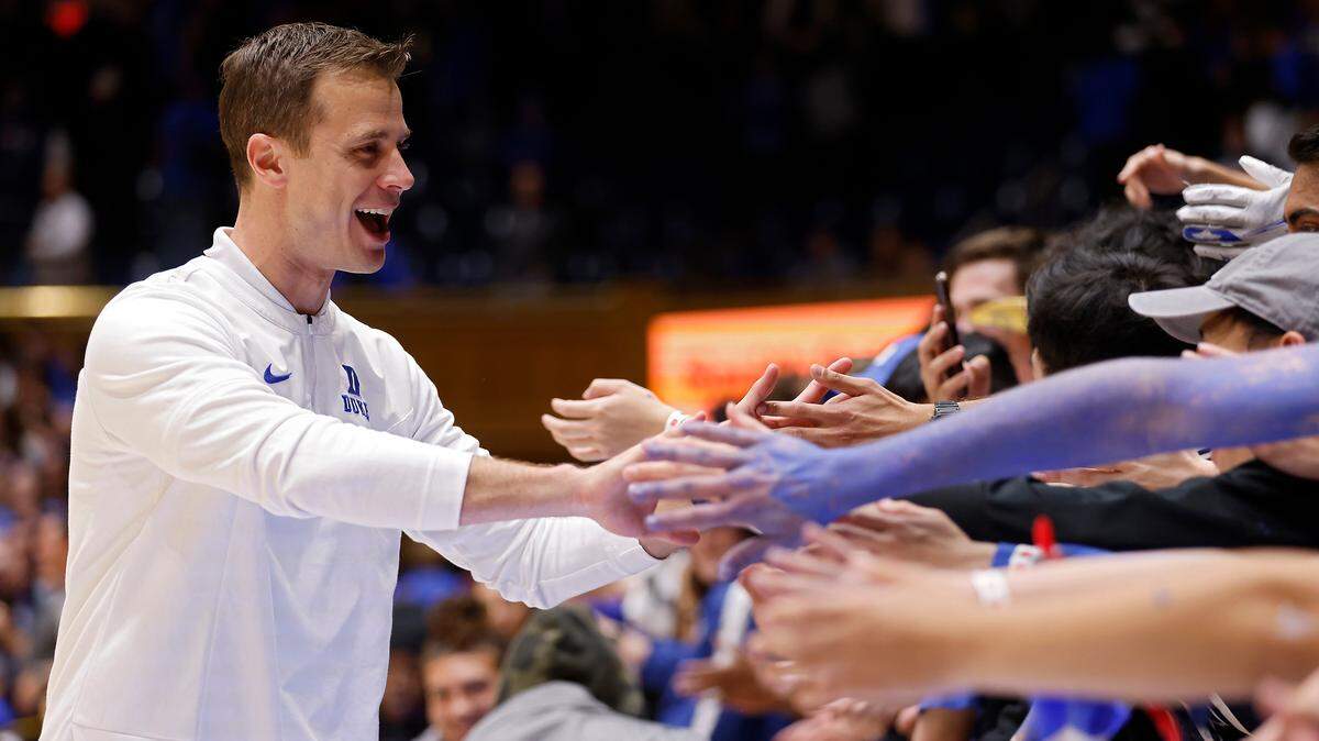 Duke head coach Jon Scheyer is congratulated by fans following the Blue Devils’ 81-65 win over Virginia Tech on Saturday, Feb. 25, 2023, at Cameron Indoor Stadium in Durham, N.C.