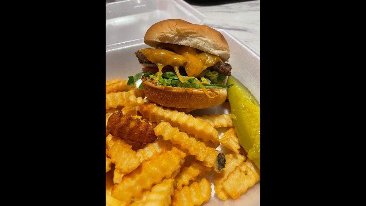 A cheeseburger with fries at Premier Cakes Diner at the NC Museum of History in downtown Raleigh.