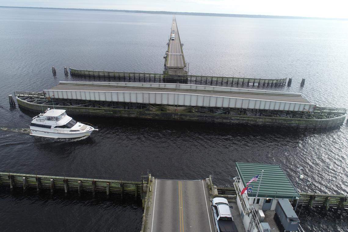 The swing-span on the Lindsay C. Warren bridge opens for boats on the Alligator River, bringing traffic on U.S. 64 between Tyrrell and Dare counties to a stop. The replacement bridge will be high enough over the channel that a drawbridge will not be necessary.