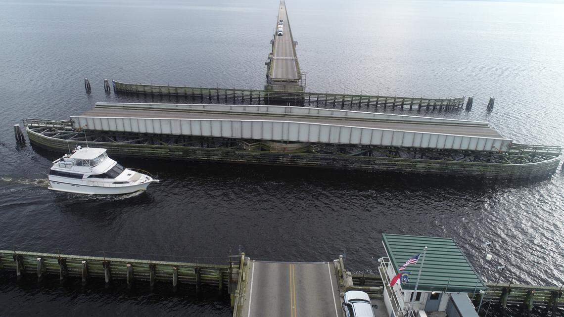 The swing-span on the Lindsay C. Warren bridge opens for boats on the Alligator River, bringing traffic on U.S. 64 between Tyrrell and Dare counties to a stop. A planned replacement bridge will be high enough over the channel that a drawbridge will not be necessary.