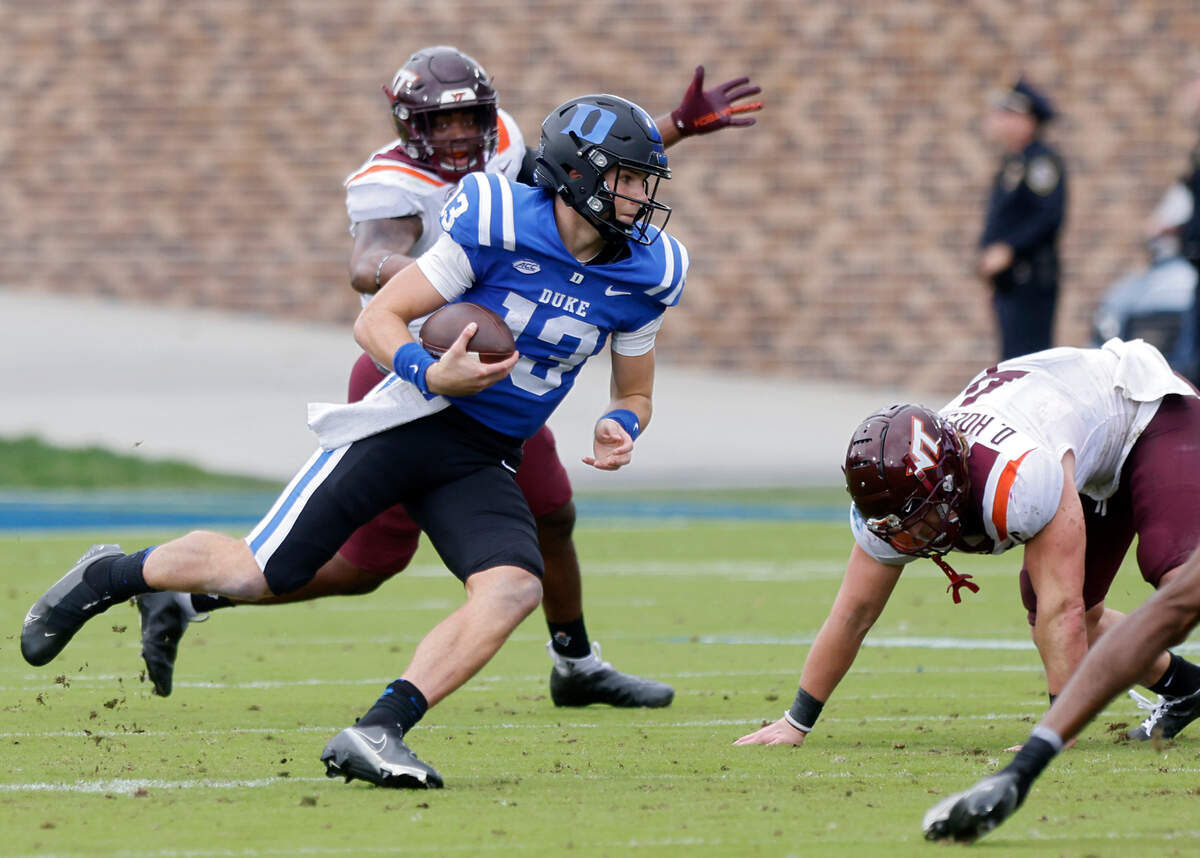 Duke quarterback Riley Leonard runs the ball during the first half of the Blue Devils’ game against Virginia Tech at Wallace Wade Stadium on Saturday, Nov. 12, 2022, in Durham, N.C.