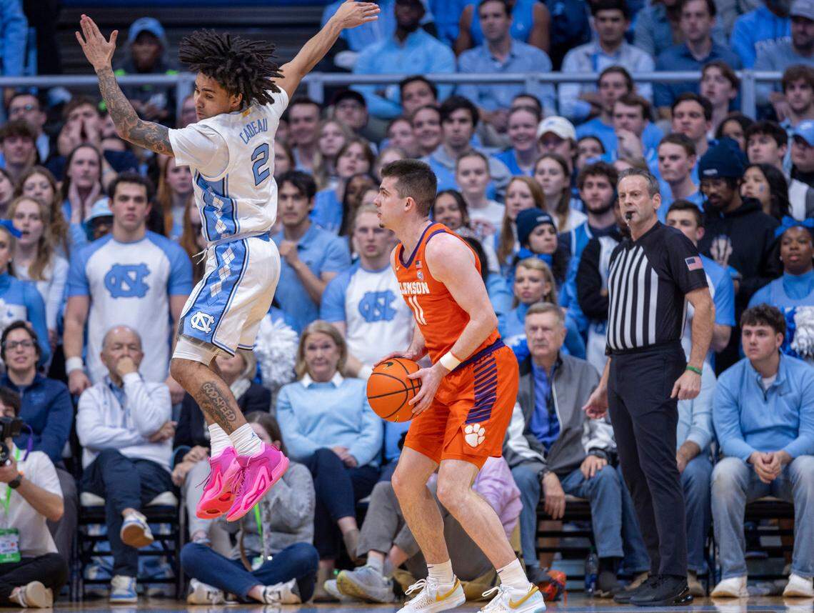 North Carolina’s Elliot Cadeau (2) defends Clemson’s Joseph Girard III (11) in the first half on Tuesday, February 6, 2024 at the Dean E. Smith Center in Chapel Hill, N.C. Girard scored 21 points in the victory.