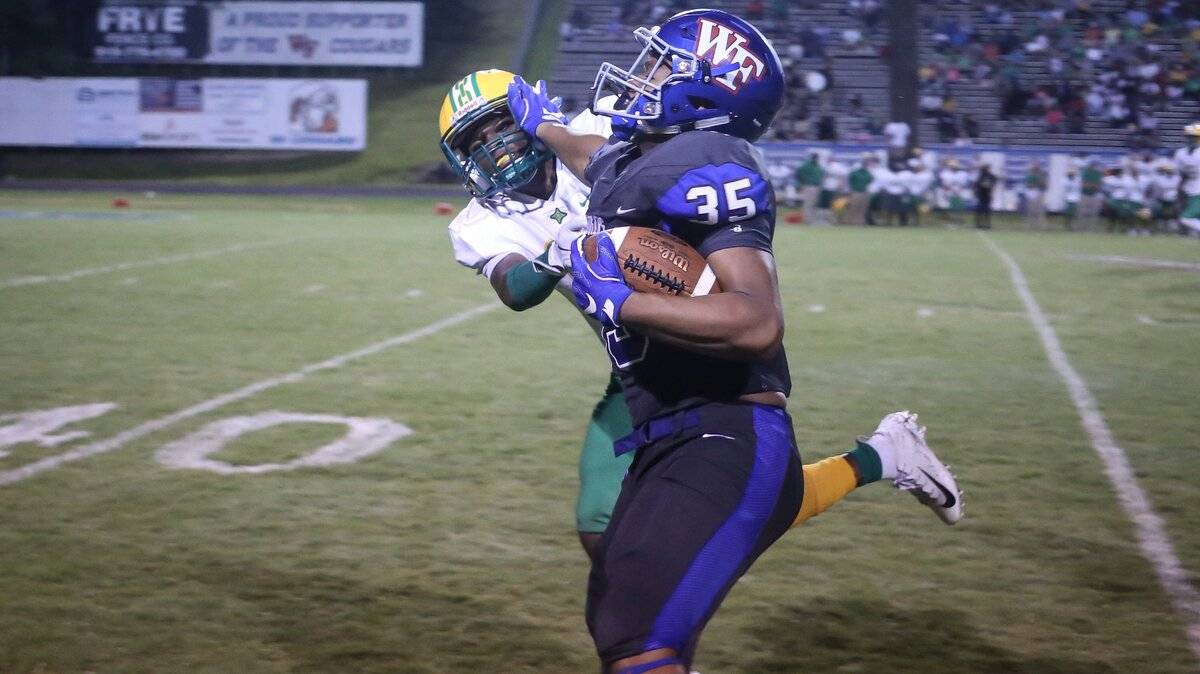 Wake Forest running back DeMarcus Jones II (35) stiff-arms a Richmond defender on a long run. The Richmond Raiders played football at the Wake Forest Cougars on Friday, August 24, 2018.