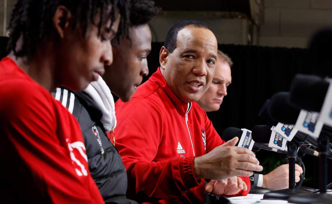 N.C. State head coach Kevin Keatts talks about Terquavion Smith, left, and Jarkel Joiner on the podium after Creighton’s 72-63 victory over N.C. State in the first round of the NCAA Tournament at Ball Arena in Denver, Colo., Friday, March 17, 2023.