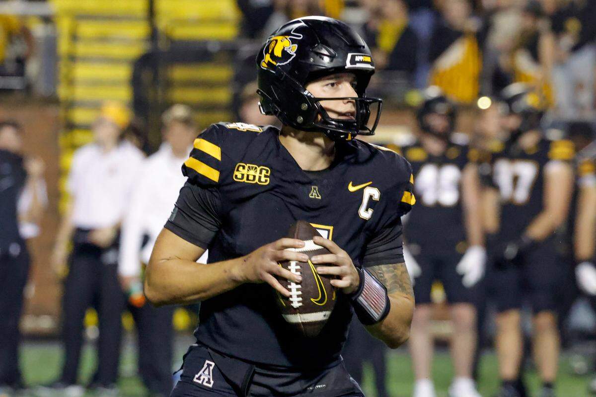 Appalachian State Mountaineers quarterback Joey Aguilar (4) drops to throw a pass during the second half against the South Alabama Jaguars at Kidd Brewer Stadium.
