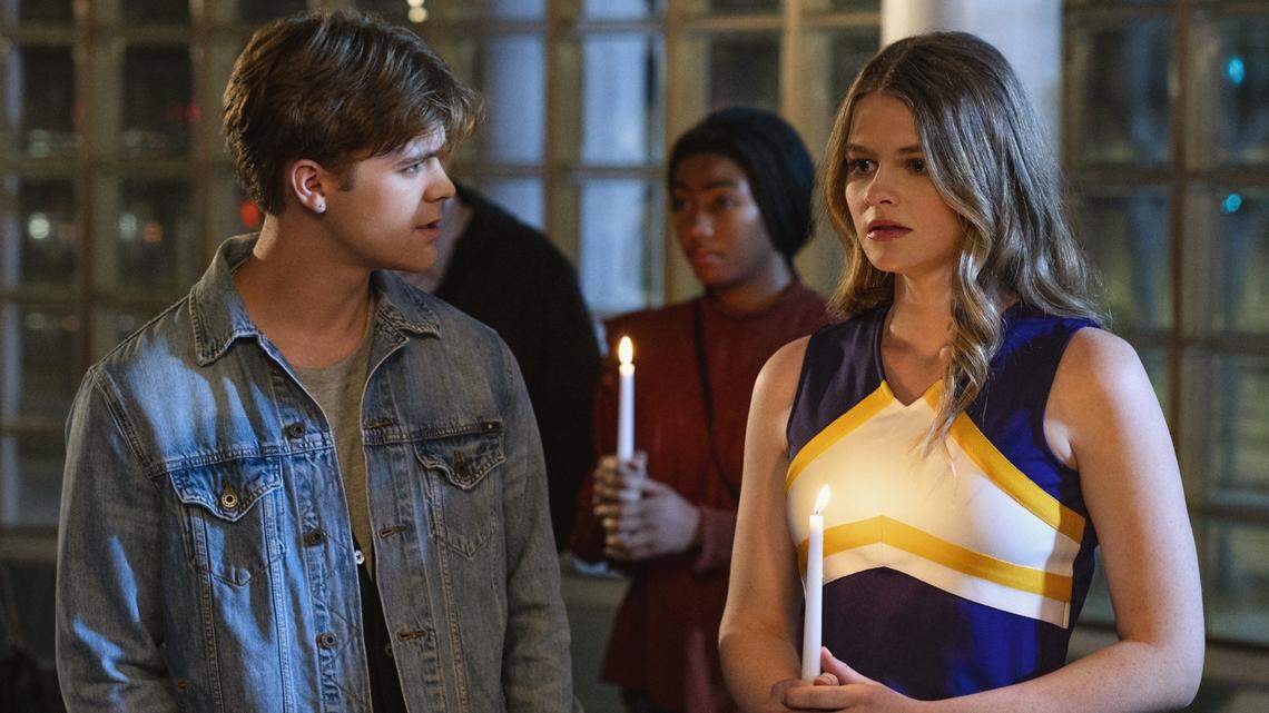 Dominique Booth, right, stars in “Dying to Be a Cheerleader” on Lifetime.