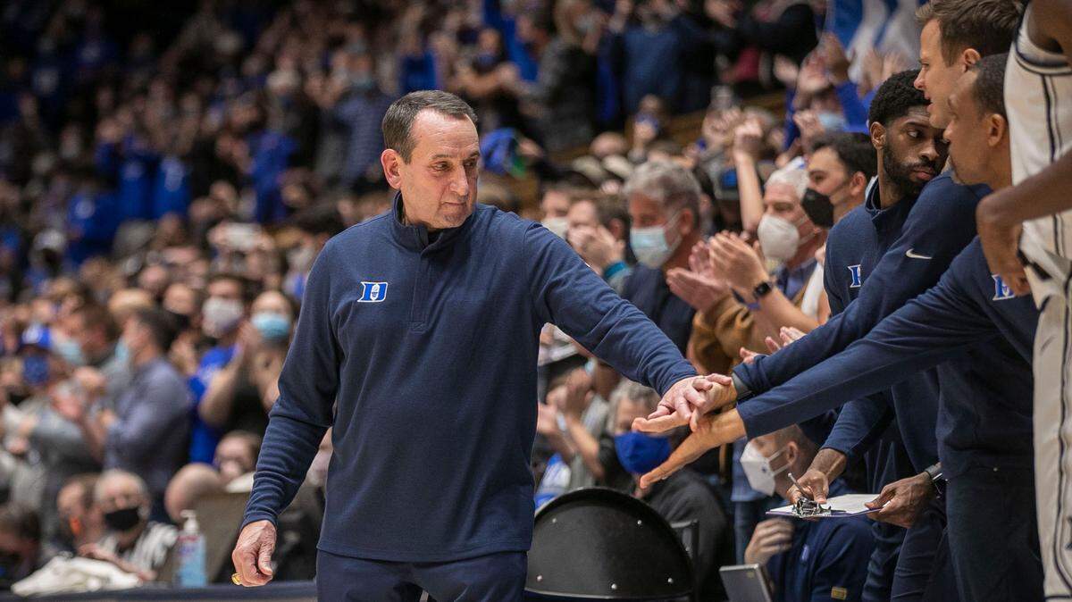Duke coach Mike Krzyzewski and assistant coach Jon Scheyer react after defeating Virginia Tech on Wednesday, December 22, 2021 at Cameron Indoor Stadium in Durham, N.C.