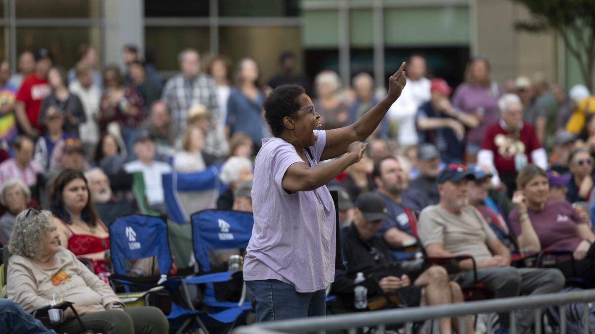 Festival-goers enjoy a live performance by the Jason Carter Band in City Plaza during the Raleigh Wide Open music festival in downtown Raleigh on Friday, Oct. 3, 2025. The event features live bluegrass, folk, Americana and gospel artists.