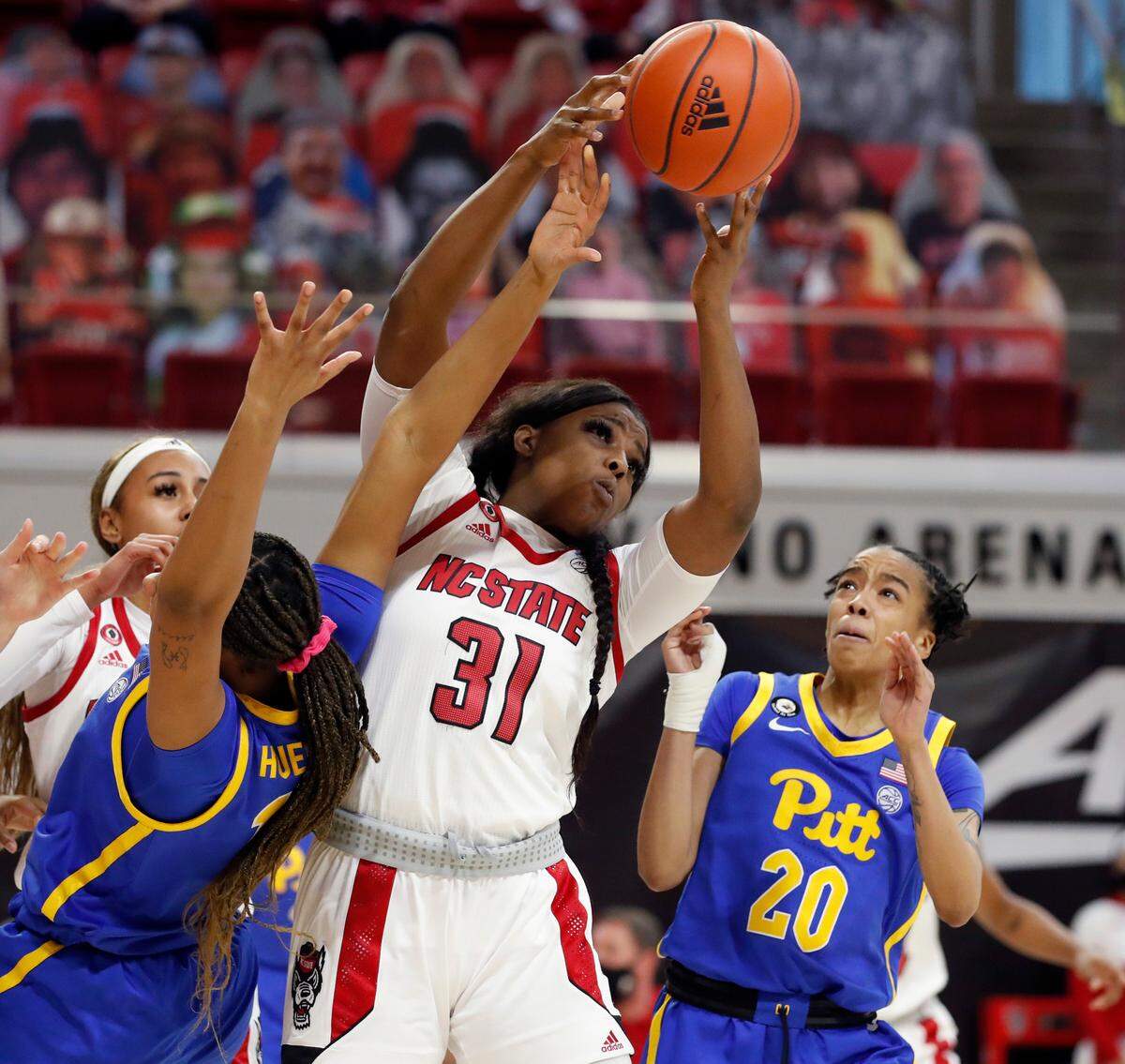 N.C. State’s Jada Rice (31) works to pull in the rebound during the second half of N.C. State’s 83-53 victory over Pittsburgh at Reynolds Coliseum in Raleigh, N.C., Thursday, February 25, 2021.
