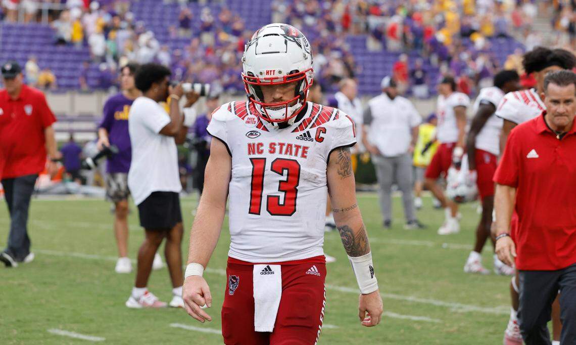 N.C. State quarterback Devin Leary (13) walks off the field after N.C. States 21-20 victory over ECU at Dowdy-Ficklen Stadium in Greenville, N.C., Saturday, Sept. 3, 2022.