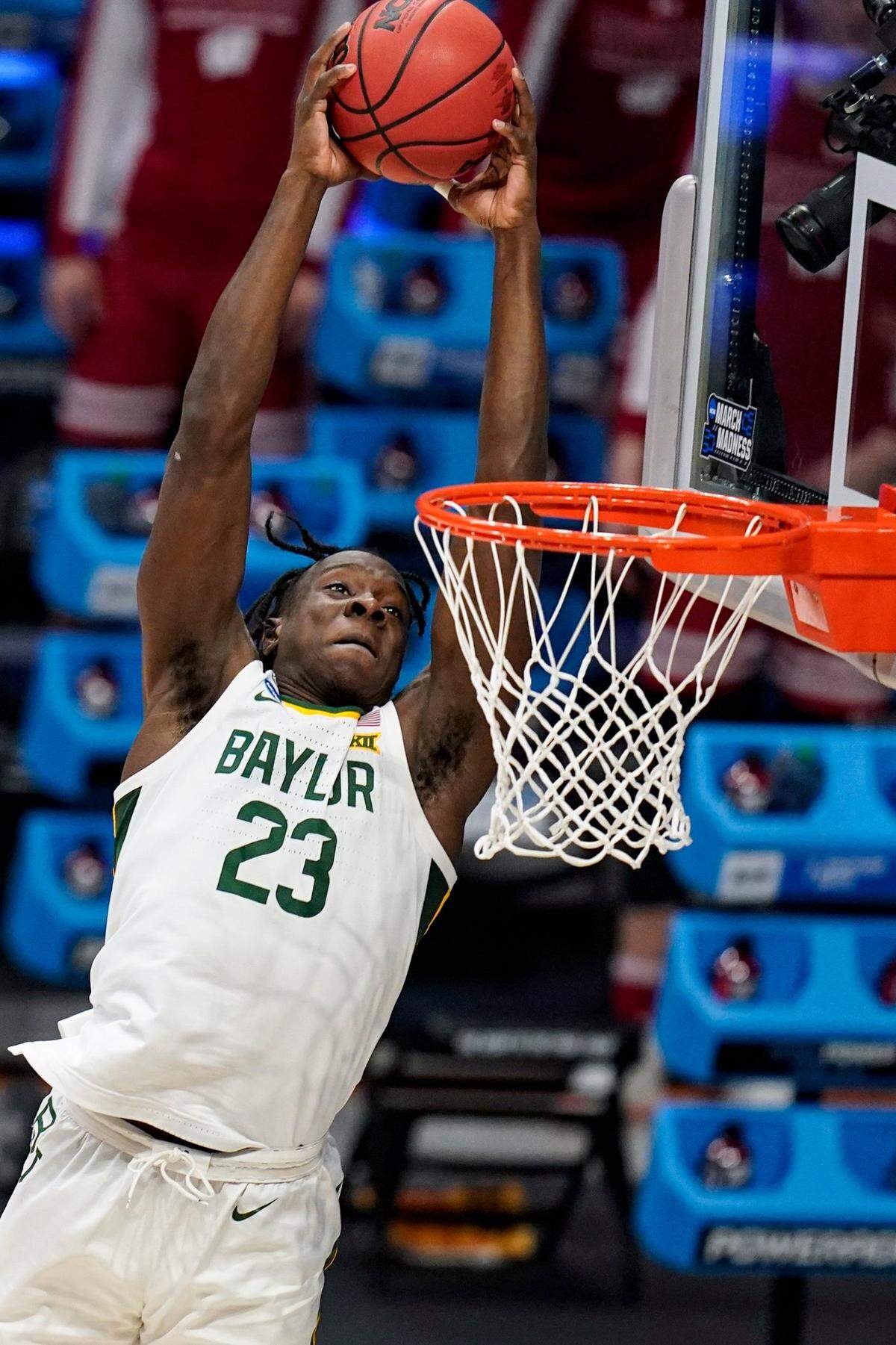 Baylor forward Jonathan Tchamwa Tchatchoua (23) goes up for a dunk against Wisconsin in the first half of a second-round game in the NCAA men’s college basketball tournament at Hinkle Fieldhouse in Indianapolis, Sunday, March 21, 2021.