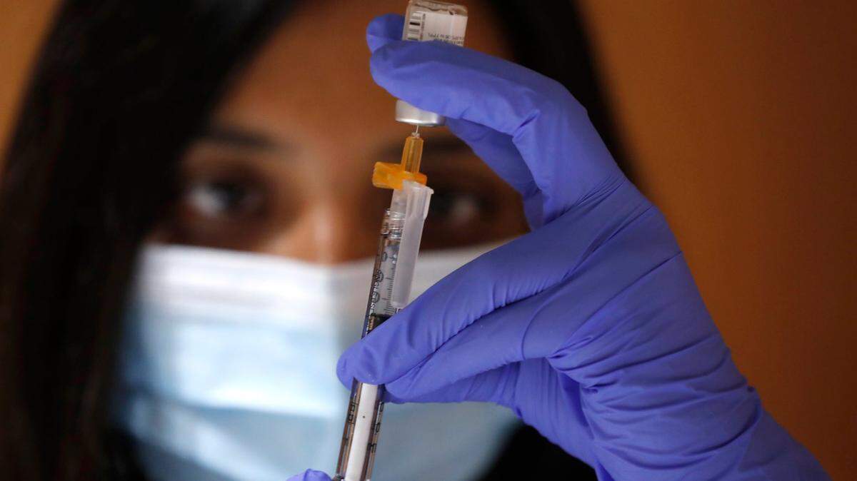 Pharmacy technician Susan Rozario withdraws a .3 ml dose of Pfizers COVID-19 vaccine during a COVID vaccine clinic for employees at UNC REX Healthcare at UNC Rex Hospital in Raleigh, N.C., Thursday, January 7, 2021.