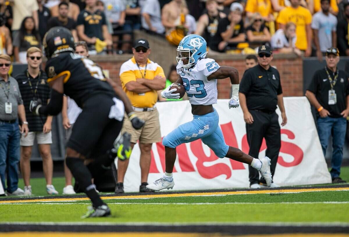 North Carolinas George Pettaway (23) races for a 21-yard touchdown in the second quarter against Appalachian State on Saturday, September 3, 2022 at Kidd Brewer Stadium in Boone, N.C.