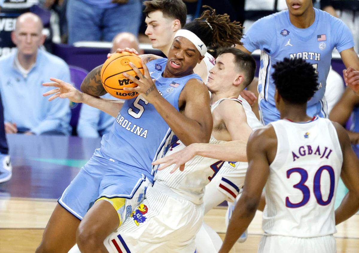 North Carolina’s Armando Bacot (5) works against Kansas’ Mitch Lightfoot (44) during the second half of Kansas’ 72-69 victory over UNC in the NCAA Men’s National Championship at the Caesars Superdome in New Orleans, La., Monday, April 4, 2022.