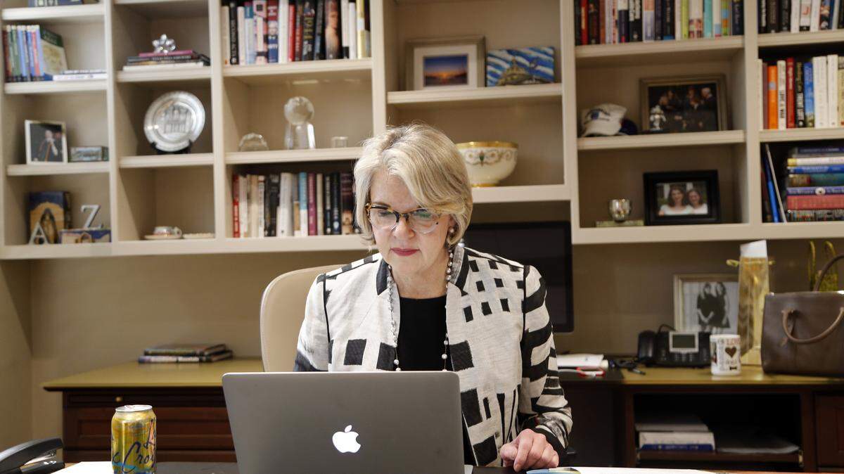 UNC system President Margaret Spellings works in her office in Chapel Hill in March 2017.
