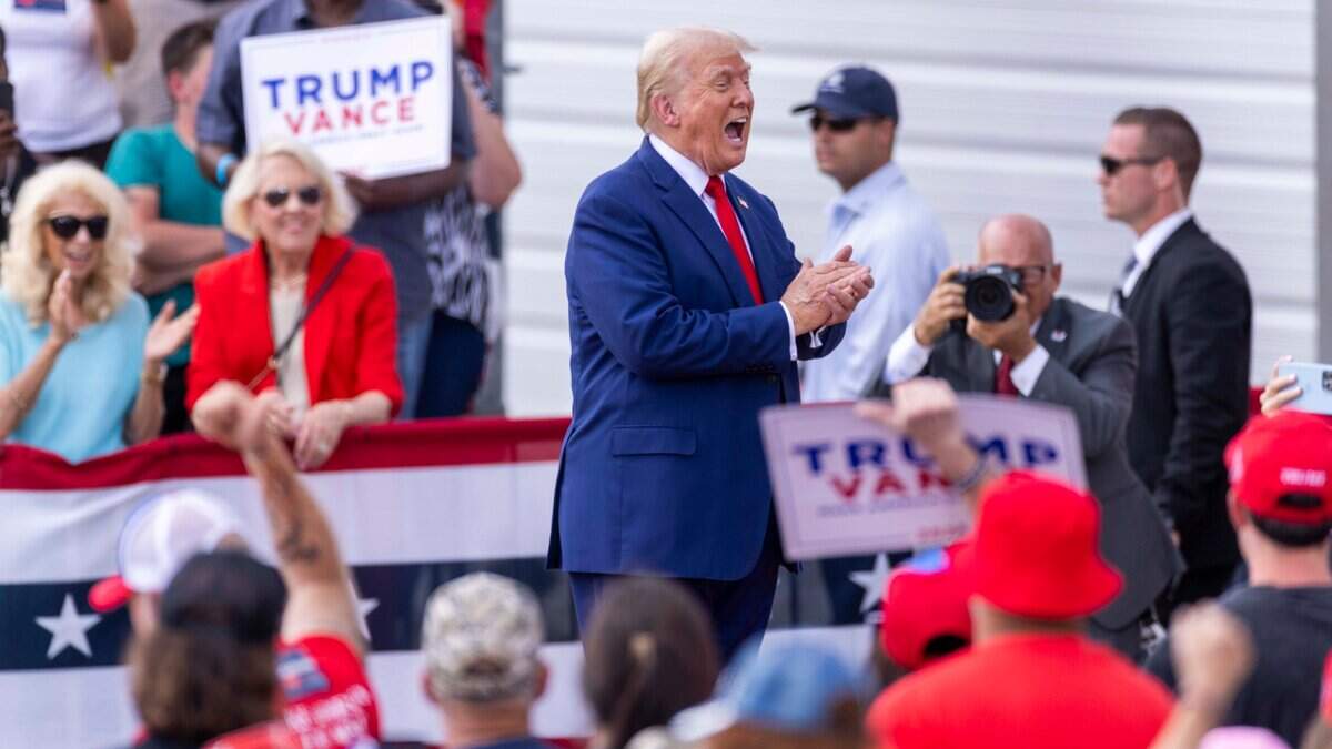 Former President Donald Trump acknowledges supporters during a rally at the North Carolina Aviation Museum & Hall of Fame in Asheboro, NC on Wednesday, Aug. 21, 2024.