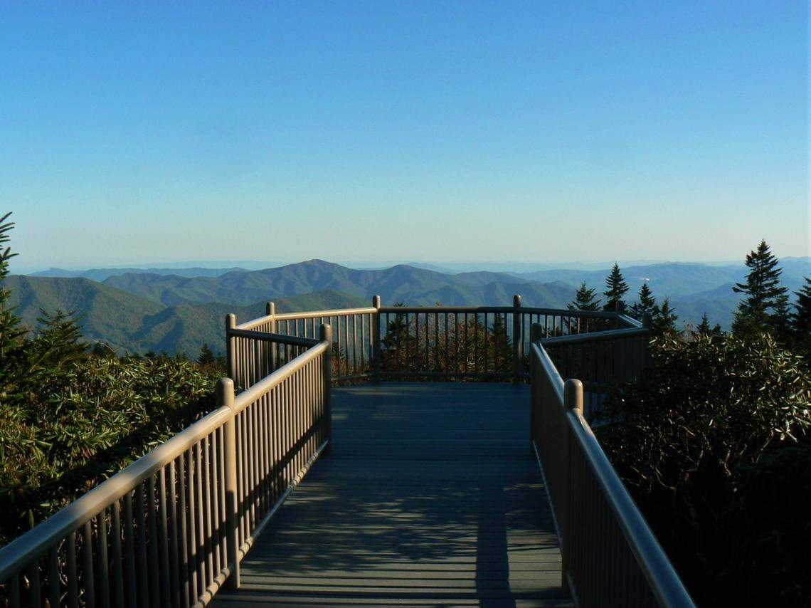 View from Roan Mountain at the Rhododendron Gardens in Mitchell County, North Carolina. The platform overlooks the South Yellow Mountain Preserve, a collection of 45 parcels donated by Epic Games CEO Tim Sweeney to the Southern Appalachian Highlands Conservancy.